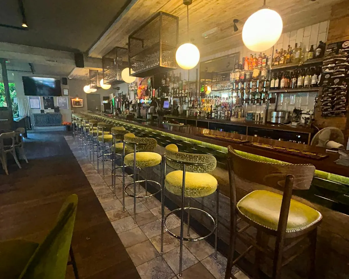 Yellow bar stools along the main bar