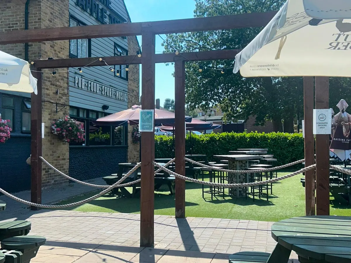 The patio and pergola, looking across to the lawn